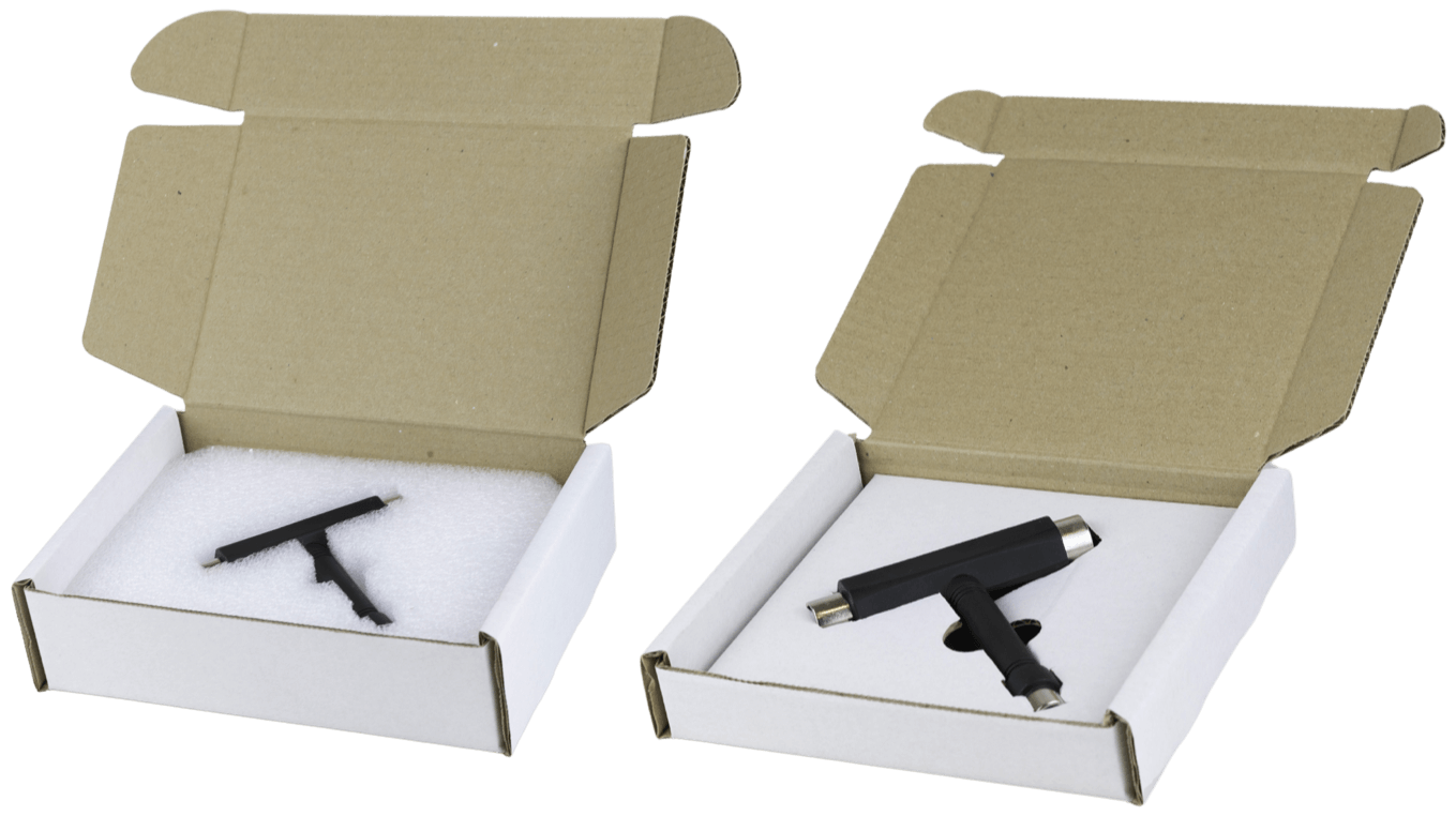 Two boxes with bespoke packaging.